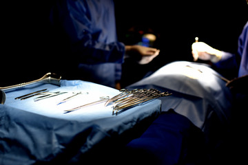 Team surgeon at work in operating room. Surgical light in the operating room. Preparation for the...