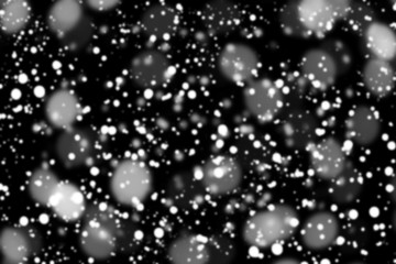 Texture of white snow blurry bokeh isolated black background. falling snow overlay. star sky. Black spots on white background, white drops and spots