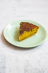 Baked vegetables casserole. Vegan and vegetarian food. Slice or piece of vegetable pie on plate