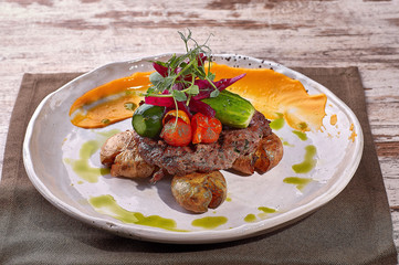 restaurant dish on white and gray plates, on a table