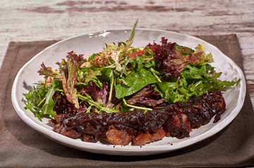 restaurant dish on white and gray plates, on a table