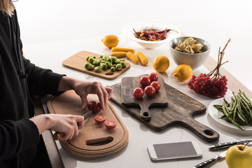 cropped view of photographer making food composition for commercial photo shoot
