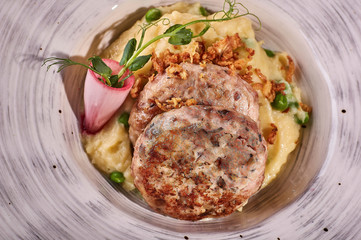 restaurant dish on white and gray plates, on a table