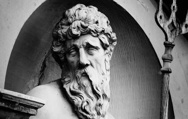 Close up ancient statue of a mighty god of the sea and oceans Neptune (Poseidon)