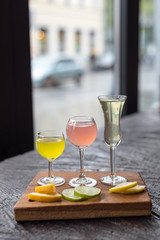 Assorted Homemade Citrus Liqueurs Limoncello Served with Orange, Lime and Lemon Slices