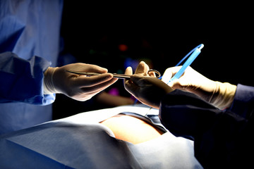 Team surgeon at work in operating room. Surgical light in the operating room. Preparation for the...