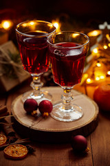 Hot mulled wine on christmas table with decoration