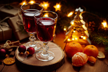 Two glasses of hot mulled wine on Christmas table