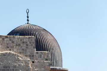 Dome of the Al Aqsa Mosque from the side of the old city. Historical places of the planet