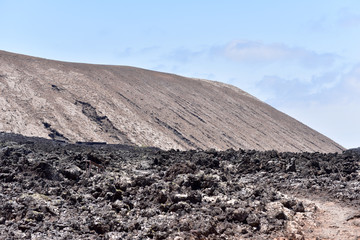 Black lava in the volcanic Timanfaya National Park, Lanzarote, Canary Islands, Spain