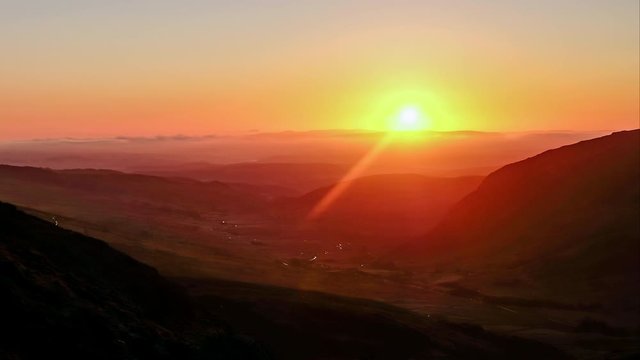 Time lapse of sun rising in the Ogwen Valley, Snowdonia Wales, UK