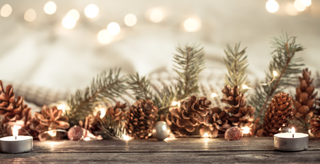 Festive New year background with cones and lights.