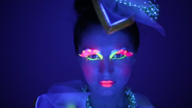Close-up of a girl with neon face