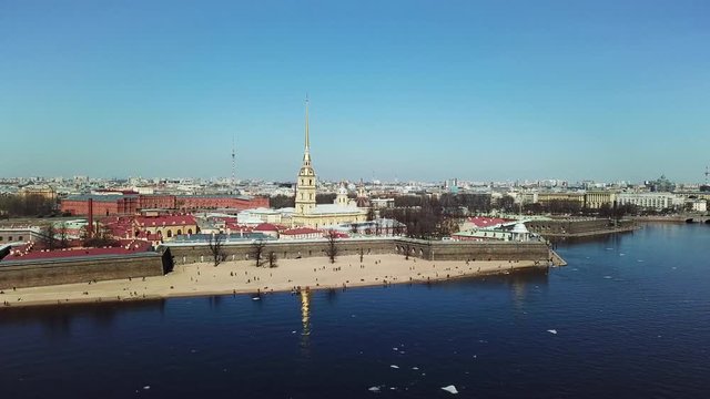 Russia, Saint-Petersburg, aerial view of Peter and Paul Fortress, sunny weather, clouds, cityscape, and blue water of Neva river. Stock footage. Tourism concept, amazing architectural ensemble.