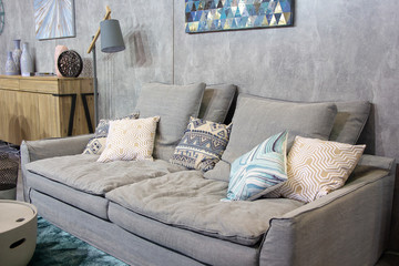 Gray minimalist room with sofa. Scandinavian interior design