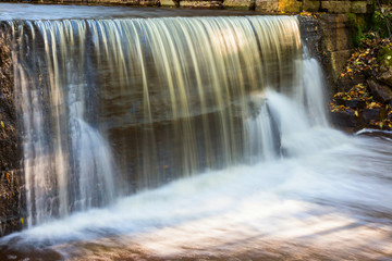 Waterfall at a mill pond