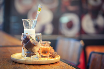 Focus selection:Ice heart latte is on a plate, try to put on the counter table in a warm atmosphere.