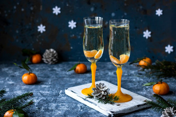 Champagne with tangerines for the New Year's table.