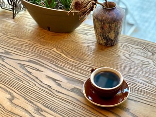 cup of coffee on wooden table