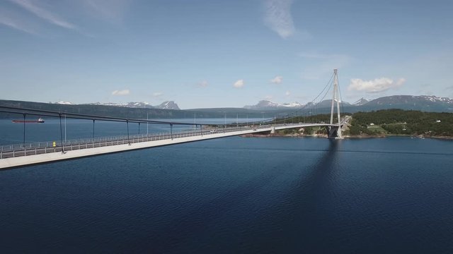 Aerial Rising View Of A Suspension Bridge In The Arctic. Infrastructure, Nature, Travel Concept. Location: H&aring;logaland Bridge, Rombaken Fjord, Norway. July Of 2019. 