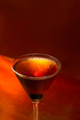 glass of cocktail on black background