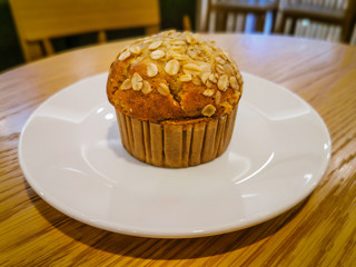 Delicious banana muffins on a white plate in a warm atmosphere