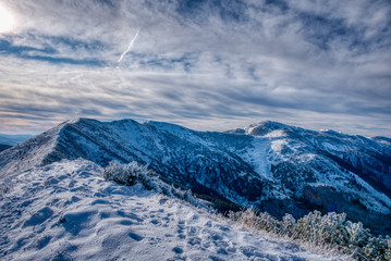 Obraz premium beautifully snowy mountains with clouds, slovakia Mala Fatra
