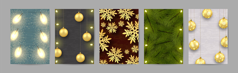 A set of five a4 format Christmas leaflets. Christmas toys, golden balls. Illuminations. Light bulbs. Sparklers. Fir branches. Golden snowflakes. Against the background of boards of different colors.