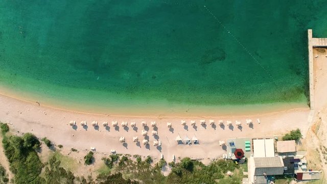 Aerial view of umbrellas at Vela luka beach, Ba&scaron;ka, Croatia.