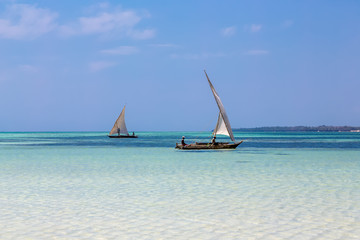 Two Traditional Dhow Boats Sailing