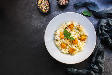 risotto mussels, pumpkin (main course, rice seafood) menu concept. food background. top view. copy...