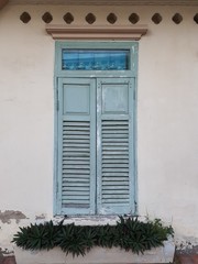 Fototapeta na wymiar old window on an orange wall