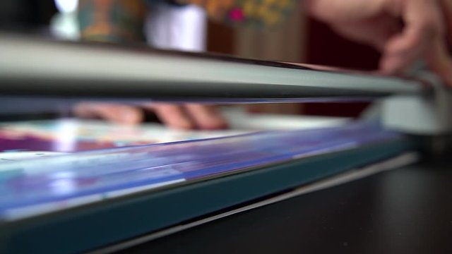 Close-up of cutting paper with cutting machine
