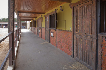 A large arena with sand for horses . Elite Horse and Polo Club . training ground. horse club. Sand Stadium for horseback riding. Horse home . Horse stables .