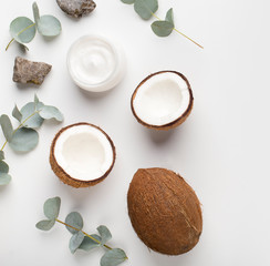 Organic face cream with natural coconut oil on white