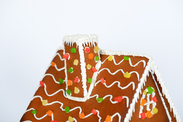 The roof and flue of hand-made eatable gingerbread house and snow decoration - 306968817