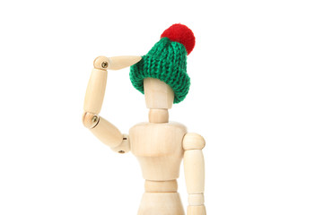 Wooden figure in green hat isolated on white background