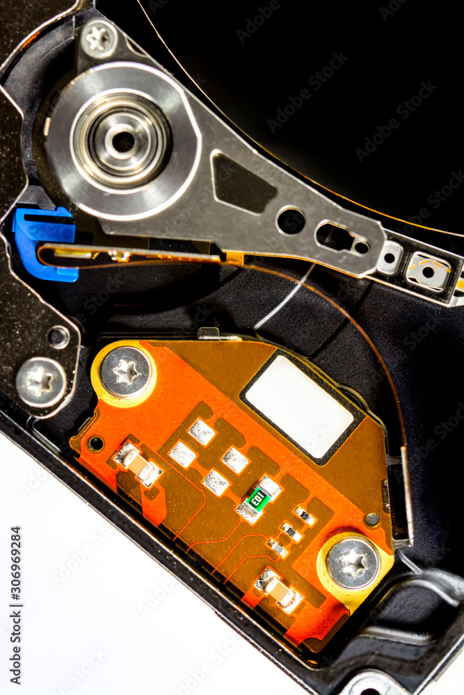 Poster disassembled hard drive from the computer, hdd with mirror effect. opened hard drive from the comput
