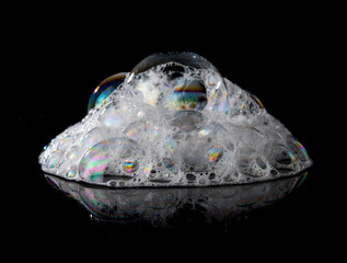 Soap foam Shaving cream bubble isolated on black background