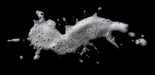 Soap foam Shaving cream bubble isolated on black background