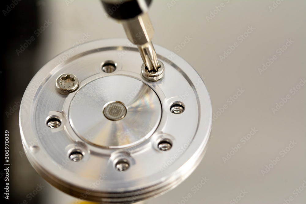 Poster disassembled hard drive from the computer, hdd with mirror effect. opened hard drive from the comput