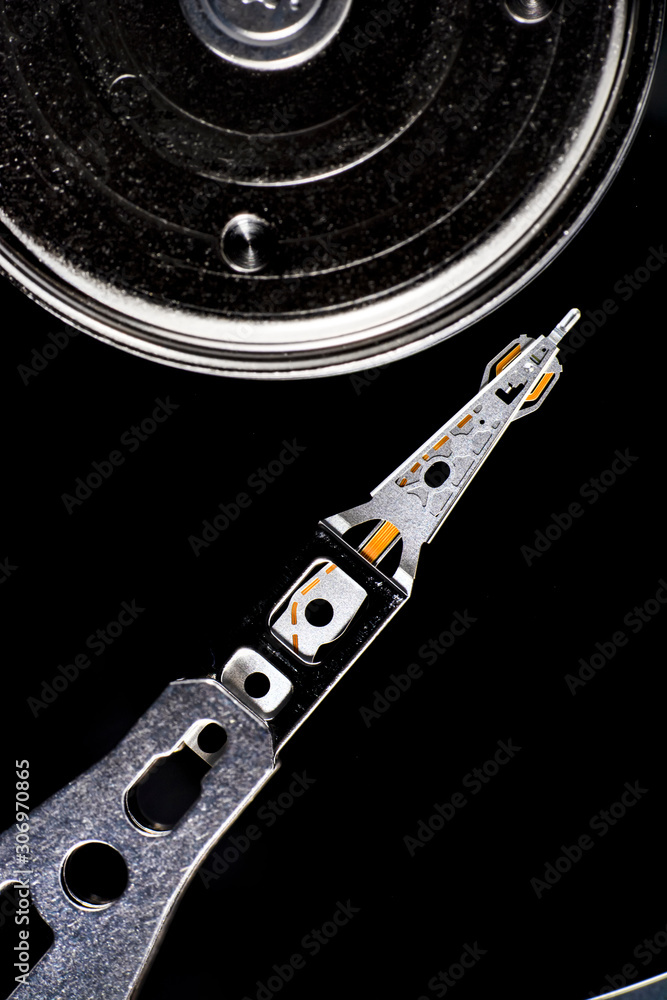 Poster disassembled hard drive from the computer, hdd with mirror effect. opened hard drive from the comput