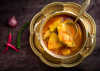 Yellow curry snapper fish with pineapple on wood table,Thai food