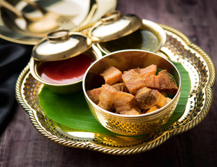 Fried pork belly with sauce on wood table,Thai food