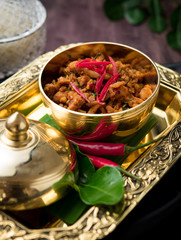 Stir Fried Chicken with Yellow Curry Paste on wood table,Thai food