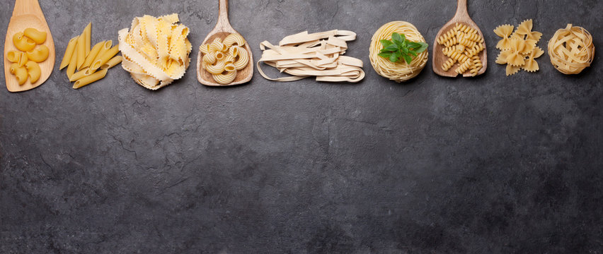Various pasta in spoons - Powered by Adobe