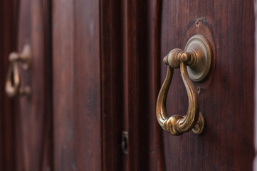 retro iron door knocker on the door