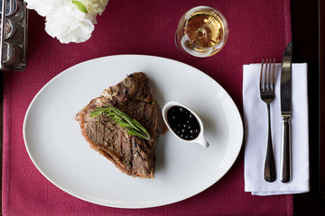 steak with sauce. Top view. Dinner in a restaurant.