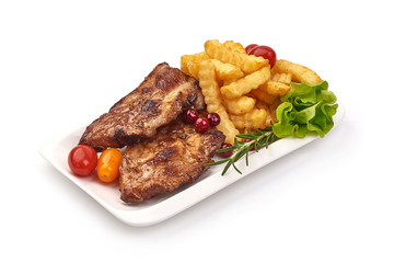 Grilled homemade pork ribs, barbecued meat with french fries, isolated on white background