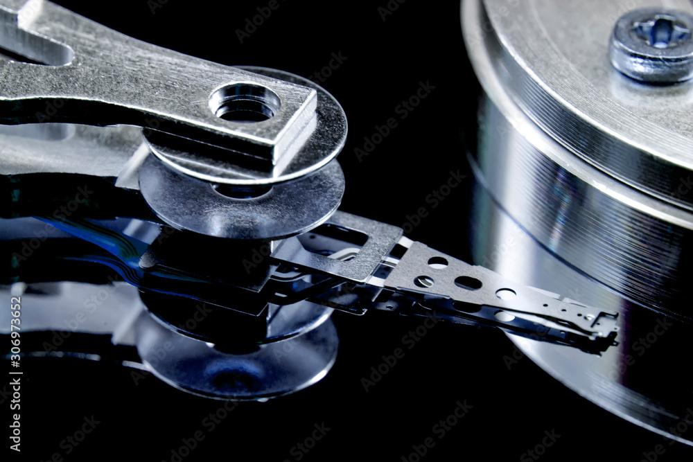 Poster disassembled hard drive from the computer, hdd with mirror effect. opened hard drive from the comput